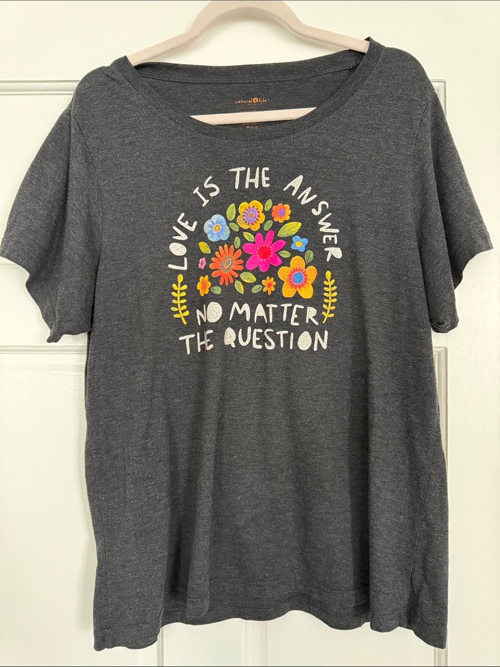 NATURAL LIFE Charcoal Tee with Bright Floral Graphic and Slogan